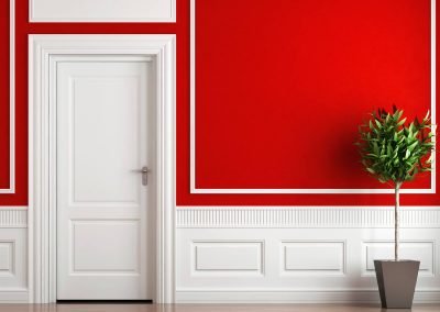 red wall with white mouldings